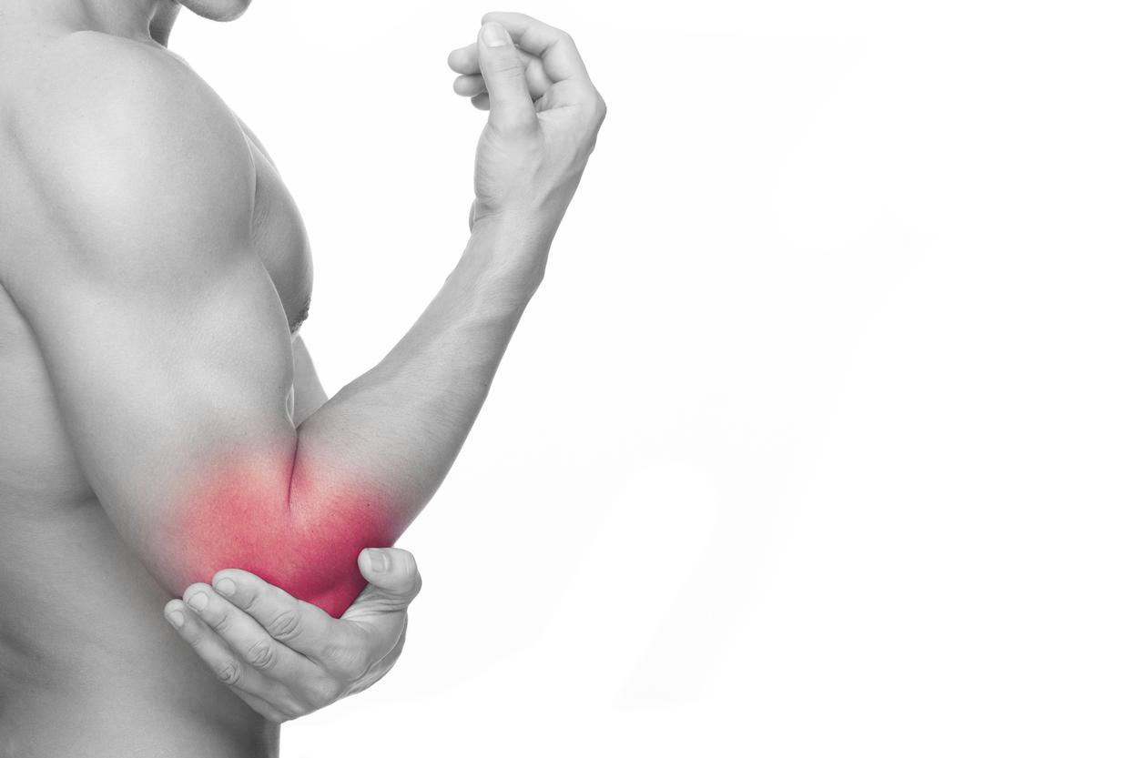 Man holding elbow with area pain found to tennis